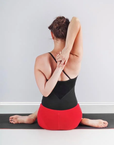 Back view – Cow Face Pose, Gomukhasana
